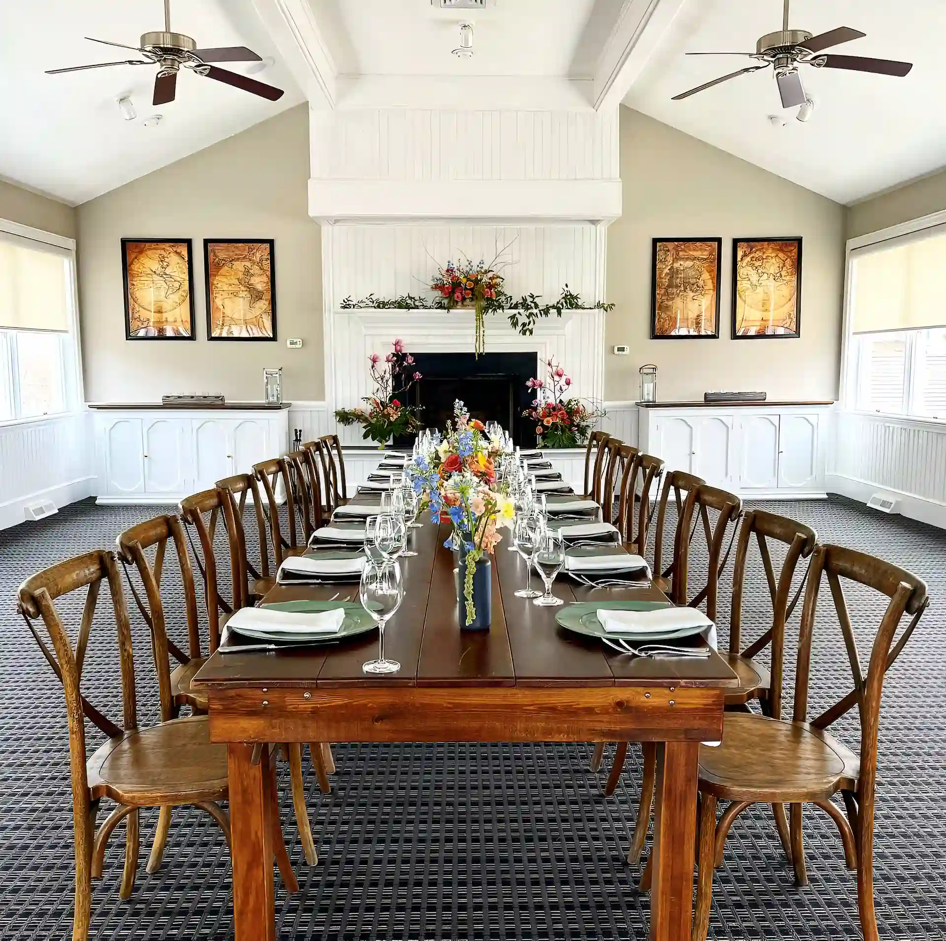 Large table with chairs and elegant cutlery inside Keepers Loft, creating a refined dining atmosphere.