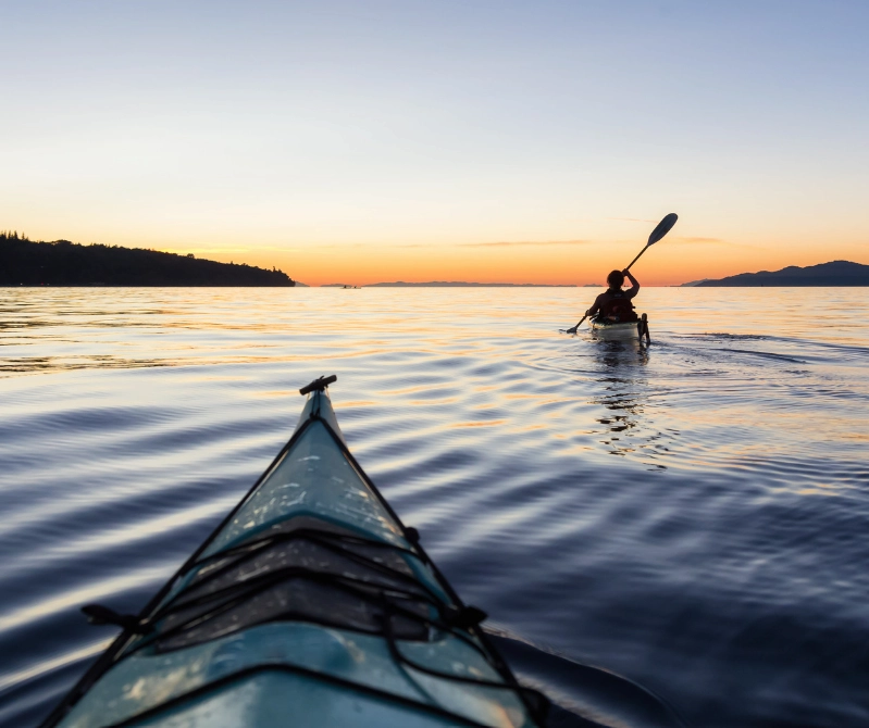 Canoe ride along the sea at sunset, near the Sanderling Resort