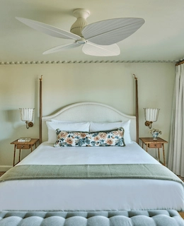 Luxurious king-sized bed in the Sanderling Hotel room, featuring exquisite décor for an elegant and inviting ambiance.